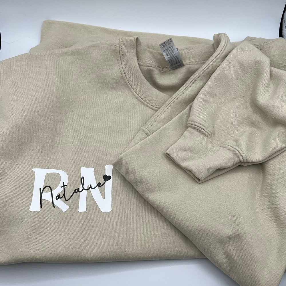 RN (registered nurse) or (rdh) w/ your personalized name on a crew neck sweater
